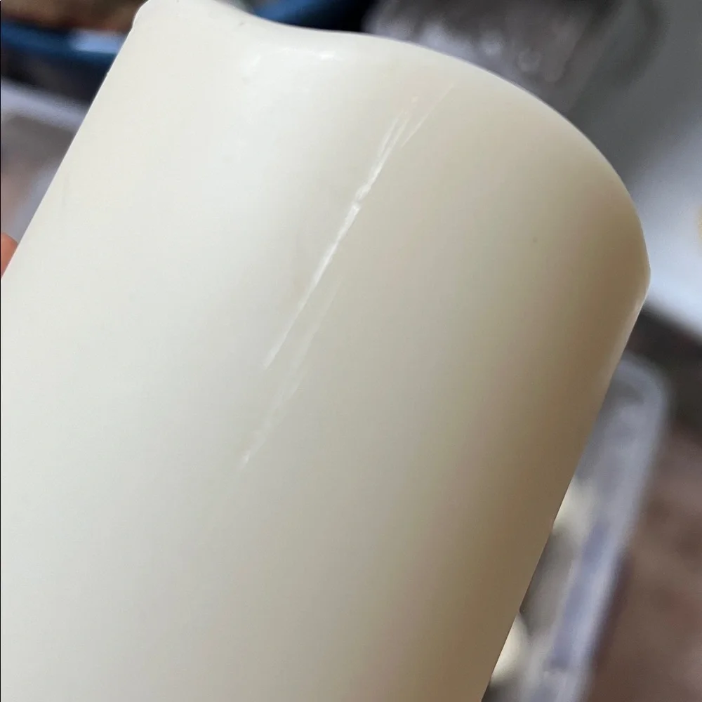 Four  candles — 4 inch cream color battery powered candles.